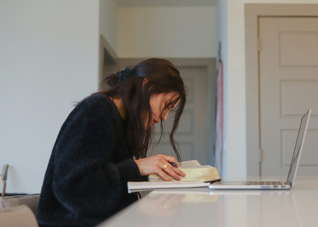 Doctoral student working through dissertation editing